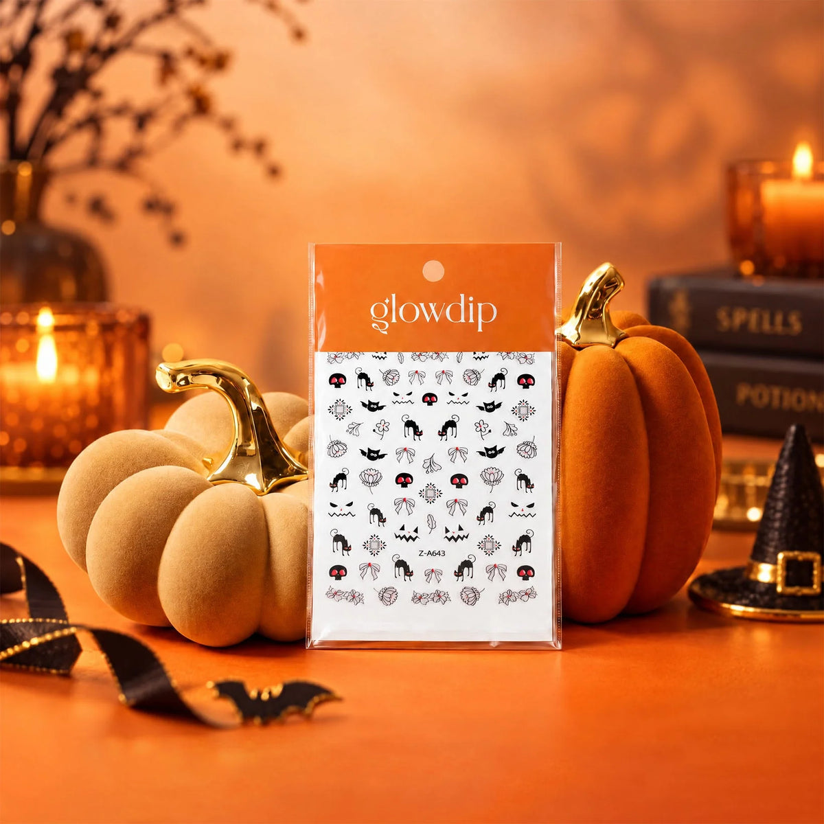 Glowdip halloween sticker sheet with black and red spooky nail designs on white background in orange sleeve packaging