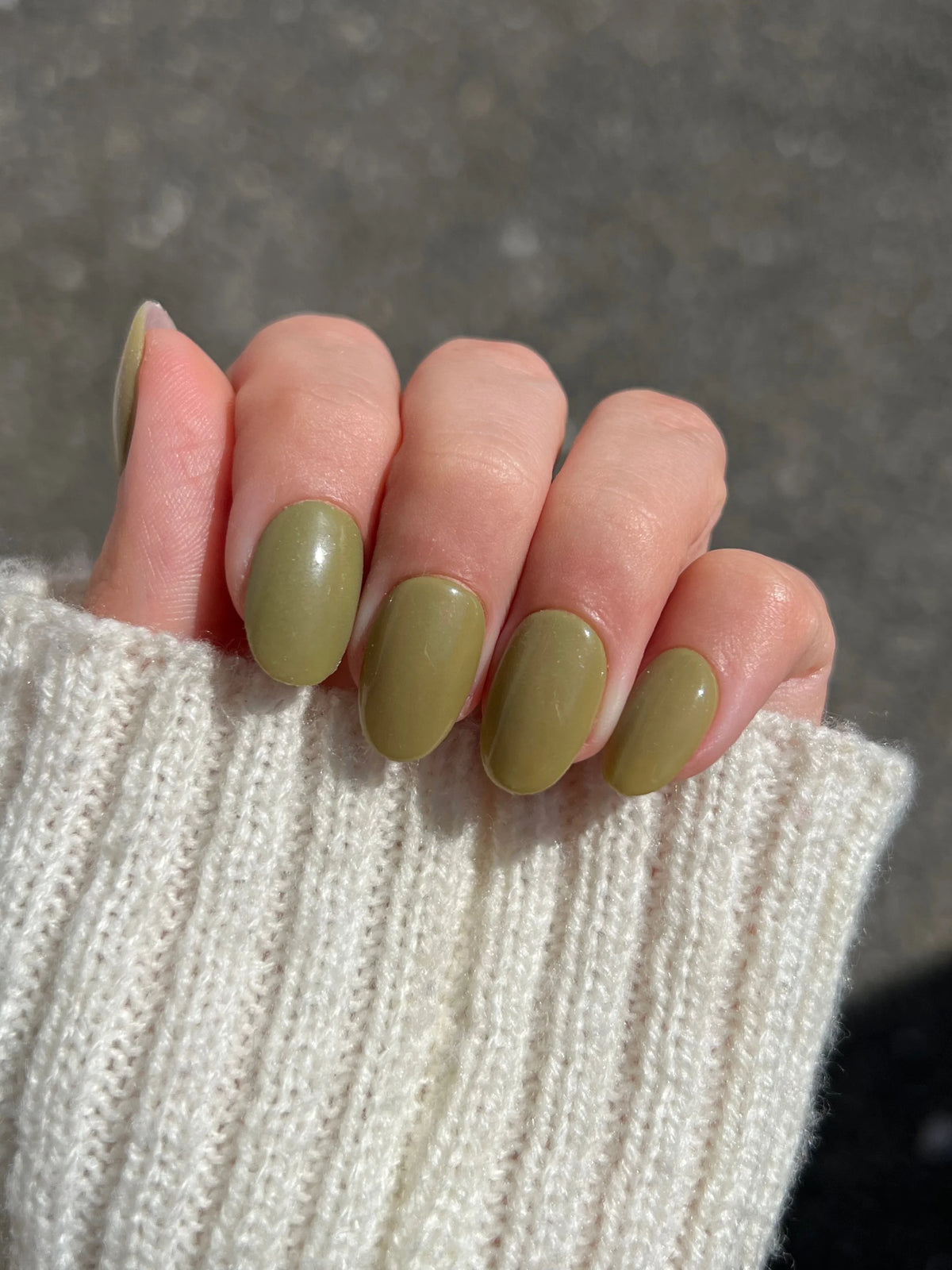 Forest muse dipping powder in olive green matte on neatly manicured nails for a natural look