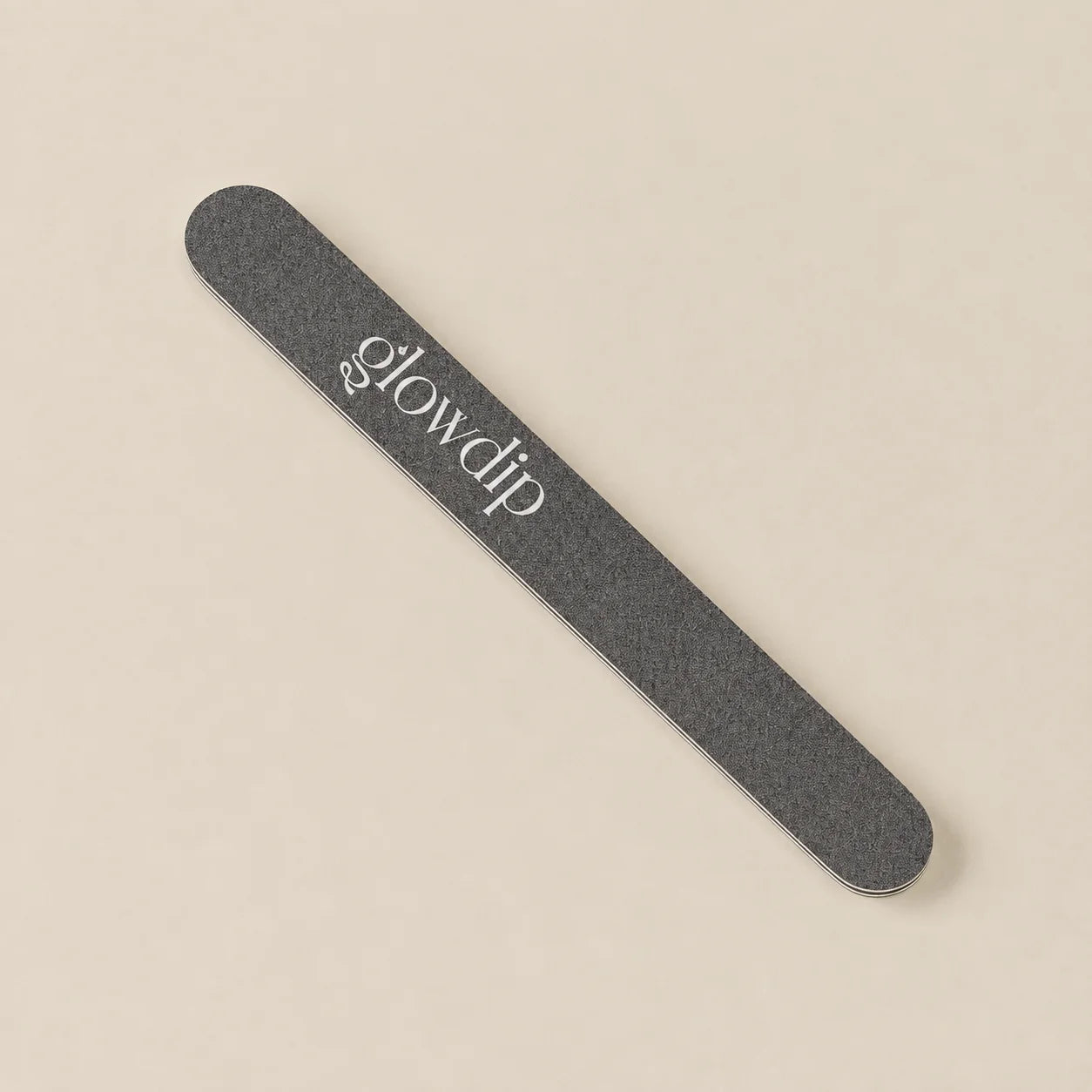 A sleek dark gray glowdip nail file with textured surface and silver lettering for precise nail shaping